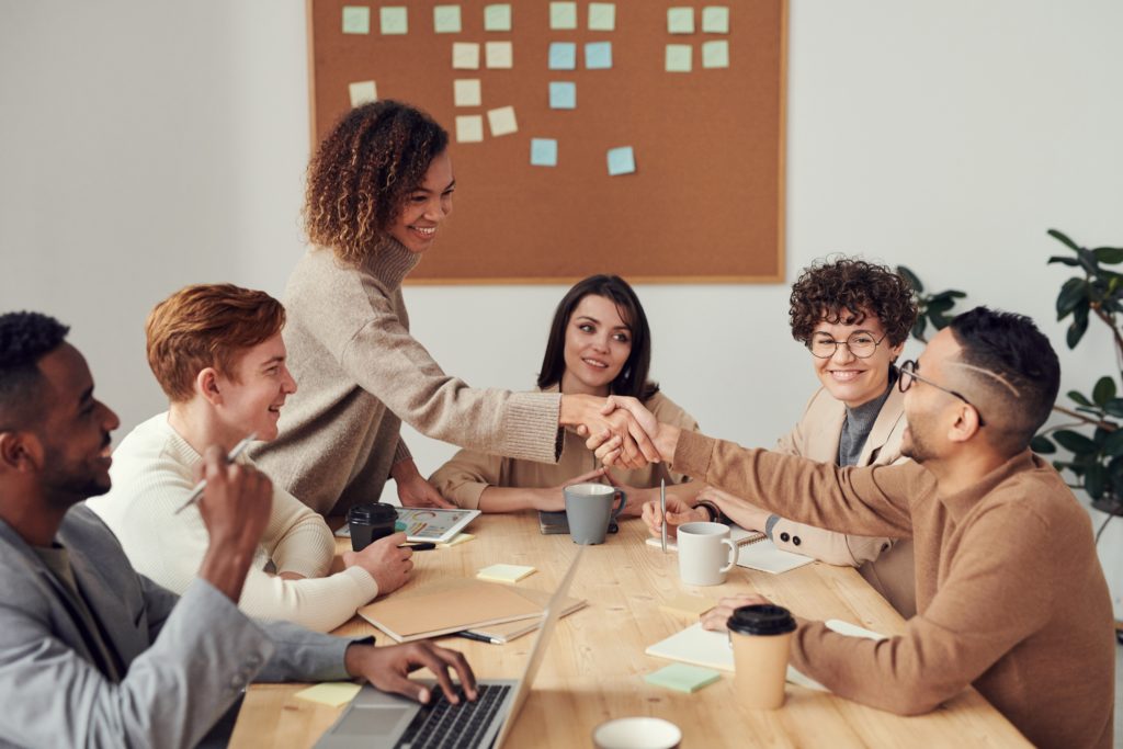 men and women in a meeting